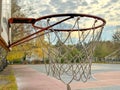 Basketball hoop against the background of the sky with clouds Royalty Free Stock Photo