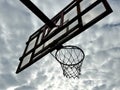 Basketball hoop against the background of the sky with clouds Royalty Free Stock Photo