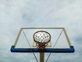 Basketball hoop against the background of the sky with clouds. Royalty Free Stock Photo