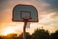 Basketball hoop and ball on sunset sky background. Sport background Royalty Free Stock Photo