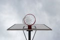 Basketball hoop, basket against white cloudy sky. Outside, street basketball court. Royalty Free Stock Photo