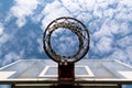 Basketball hoop from below looking up into the bright blue sky Royalty Free Stock Photo