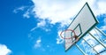 Basketball hoop on a blue sky with clouds. Royalty Free Stock Photo