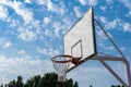 Basketball hoop blue sky white clouds outdoor Royalty Free Stock Photo