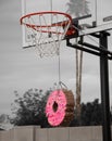 Basketball hoop with a donut pinata
