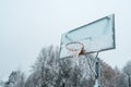 Basketball hoop with net, covered by hoarfrost