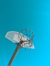 Basketball hoop on pole against blue sky in daylight Royalty Free Stock Photo