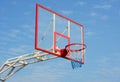 Basketball hoop in the public arena outdoors. Basketball hoop and backboard against blue sky Royalty Free Stock Photo