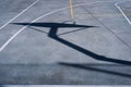 Basketball hoop shadow on the asphalt Royalty Free Stock Photo