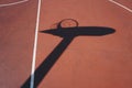 Basketball hoop shadow silhouette on the court on the street Royalty Free Stock Photo