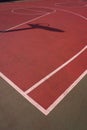 Basketball hoop shadow silhouette on the court on the street Royalty Free Stock Photo