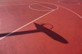 Basketball hoop shadow silhouette on the court on the street Royalty Free Stock Photo