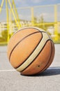 Basketball iluminating by sunlight Royalty Free Stock Photo