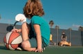 Basketball kids game. Cute little child boy holding a basket ball trying make a score. Royalty Free Stock Photo