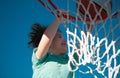 Basketball kids game. Cute little child boy holding a basket ball trying make a score.