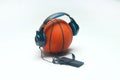 Basketball listing music with headphone and smartphone. Royalty Free Stock Photo