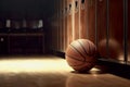 basketball is in the locker room of the gym next to the lockers for the athletes