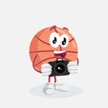 Basketball mascot and background with camera pose Royalty Free Stock Photo