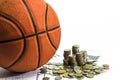 Basketball and money coins on white background