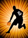 Basketball player on the abstract orange background Royalty Free Stock Photo