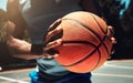 Basketball, basketball player and athlete hands closeup holding ball on basketball court in urban city park outside