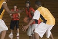 Basketball Player With Ball Being Blocked By Opponents Royalty Free Stock Photo