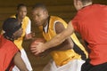 Basketball Player With Ball Being Blocked By Opponents Royalty Free Stock Photo