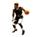Basketball player in black jersey running and dribbling with ball, polygonal vector illustration. Rear view Royalty Free Stock Photo