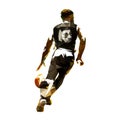 Basketball player in black jersey running and dribbling ball Royalty Free Stock Photo