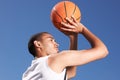 Basketball, player and game shoot in blue sky on outdoor court as fitness challenge or sports train, match as athlete Royalty Free Stock Photo