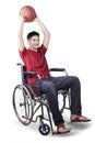 Basketball player holding a ball on the wheelchair Royalty Free Stock Photo