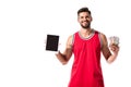 Basketball player holding digital device with blank screen and money