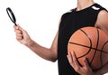 Basketball player holding a magnifying glass
