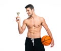 Basketball player holding winners cup Royalty Free Stock Photo