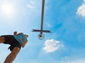 Basketball player by the hoop seen from below Royalty Free Stock Photo