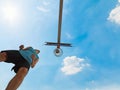 Basketball player by the hoop seen from below Royalty Free Stock Photo