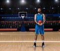 Basketball player im blue uniform standing on basketball court