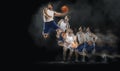 Basketball player jumping with ball on black bakground. collage