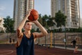 Basketball player makes a throw on outdoor court Royalty Free Stock Photo