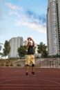Basketball player makes a throw on outdoor court Royalty Free Stock Photo