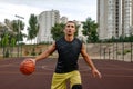 Basketball player in motion on outdoor court Royalty Free Stock Photo