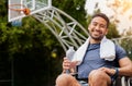 Basketball player, portrait and water for man in wheelchair on sports break, rest and drinking fitness electrolytes on Royalty Free Stock Photo