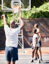 Basketball player, score and point in sports game for goal, victory or winning throw at the court outdoors. Man in Royalty Free Stock Photo