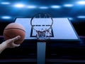 Basketball Player scoring an athletic, amazing slam dunk in a professional basketball game Royalty Free Stock Photo