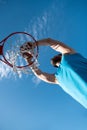 Basketball player shooting ball in hoop outdoor court. Urban youth game. Concept of sport success, scoring points and Royalty Free Stock Photo