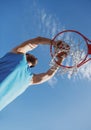 Basketball player shooting ball in hoop outdoor court. Urban youth game. Concept of sport success, scoring points and Royalty Free Stock Photo