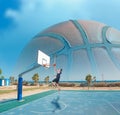 Basketball player shooting by the sea Royalty Free Stock Photo