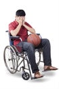 Basketball player sitting on wheelchair with ball Royalty Free Stock Photo