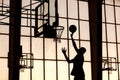 Basketball player slams it Royalty Free Stock Photo