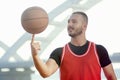 Basketball player spinning ball on finger Royalty Free Stock Photo